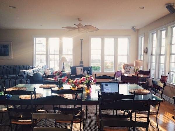 Living room with a table and chairs.