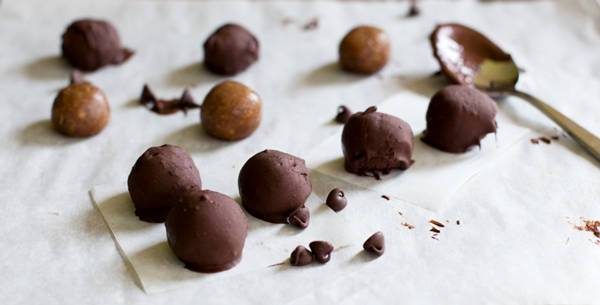 Peanut butter cookie dough balls covered in chocolate.