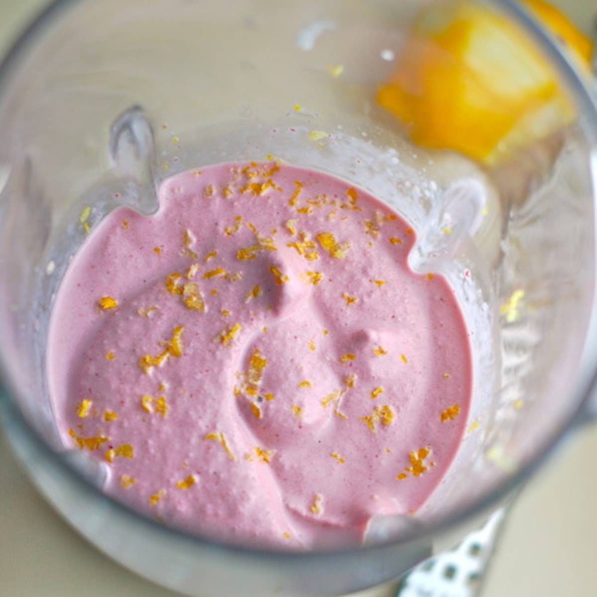 Lemon berry smoothie in a blender.