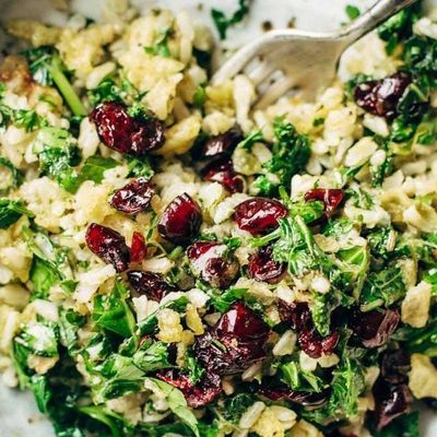 Garlic Kale and Brown Rice Salad in a bowl with a fork.