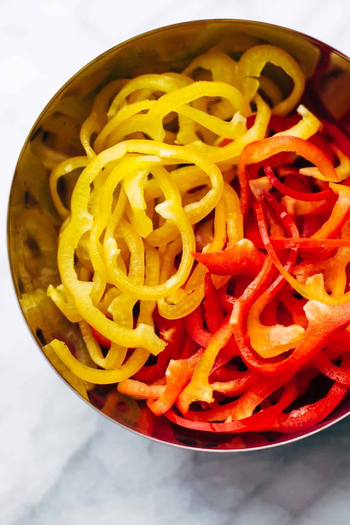 Korean BBQ Steak Bowls! Featuring Korean BBQ steak, bell peppers, scallions, greens, wonton strips, a spicy sesame ginger dressing. | pinchofyum.com